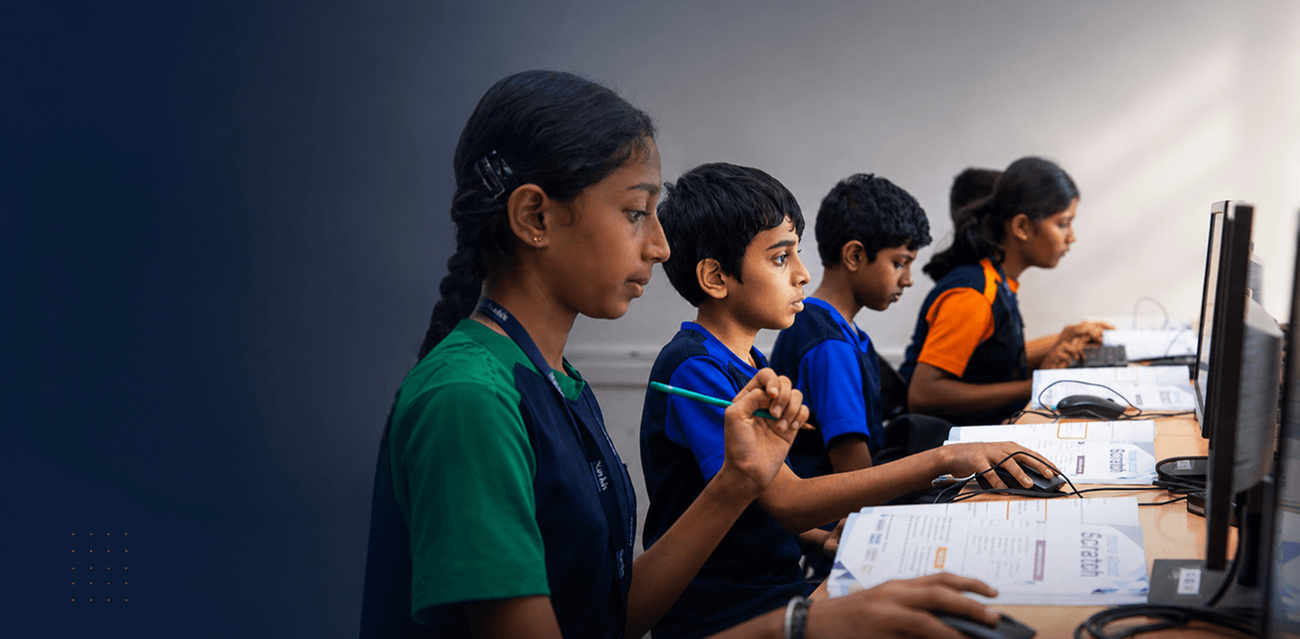 Students learning coding in computer laboratory
